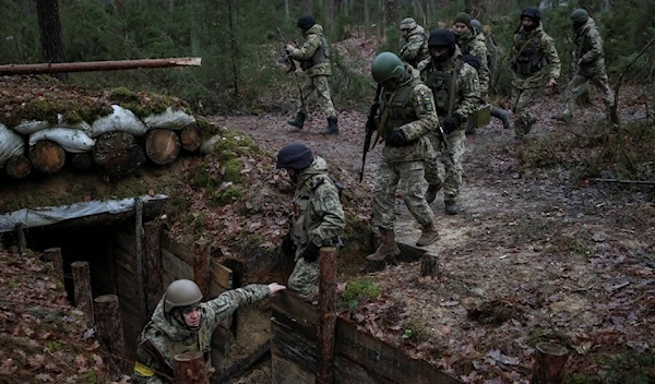 Ukrainian Border Guards are seen at their positions near the border with Belarus, amid Russia's attack on Ukraine in Volyn region, Ukraine, January 13 (Reuters).