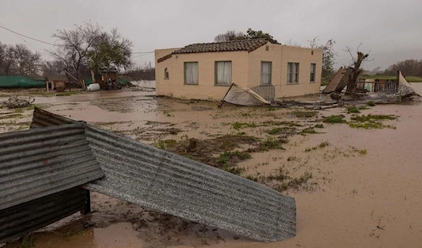 Flood waters inundate a home by the Salinas River near Chualar, California, on on January 14, 2023, as a series of atmospheric river storms continue to cause widespread destruction across the state (AFP)