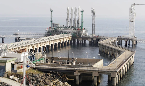 This Jan. 8, 2009 file photo shows a Turkish coast guard boat, left in the foreground, at the port of the BOTAS liquefied natural gas, LNG, import terminal in Marmara Ereglisi, near the city of Tekirdag, western Turkey (AP Photo/Murad Sezer, File)