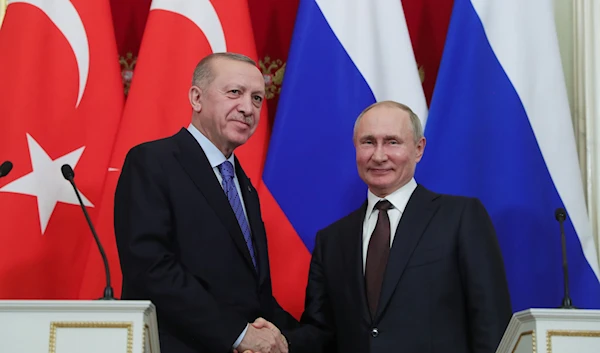 President Recep Tayyip Erdogan and Russia's President Vladimir Putin shake hands after a joint news conference in Moscow, Russia, March 6, 2020 (AA Photo)