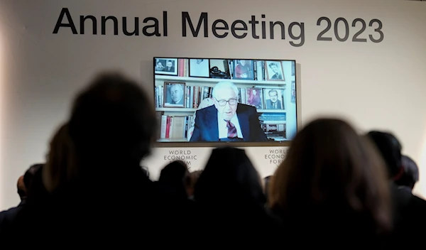 Former U.S. Secretary of State Henry Kissinger appears on screen a panel during the annual meeting of the World Economic Forum, in Davos, Switzerland Tuesday, Jan. 17, 2023 (AP Photo/Markus Schreiber)