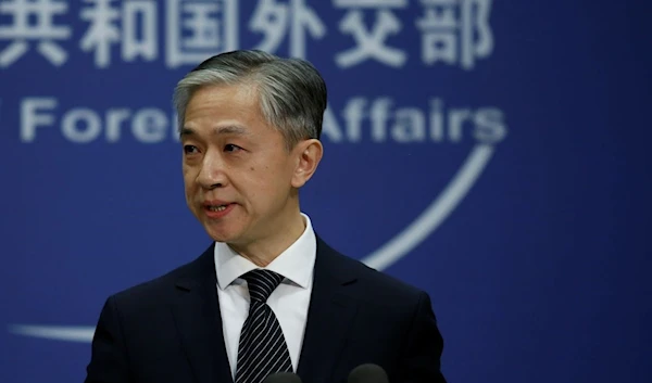 Chinese Foreign Ministry spokesman Wang Wenbin during a news conference (Reuters)