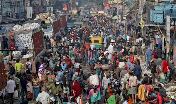 Crowded market in India in July 2022 (Reuters)