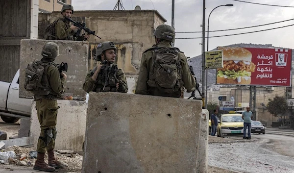 IOF raid the Palestinian village of Huwara, south of Nablus in the occupied West Bank on 26 October 2022 (AFP)