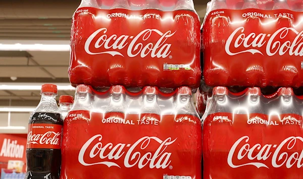 Bottles of Coca-Cola are displayed at a supermarket (Reuters)