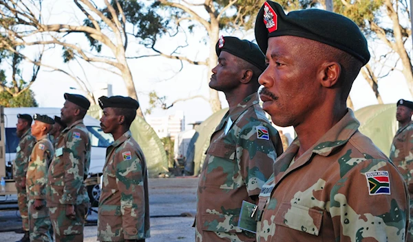 South African National Defense Force soldiers stand at attention during a rehearsal for exercise Shared Accord 2013 in Port Elizabeth, South Africa, July 21, 2013. (Wikimedia)