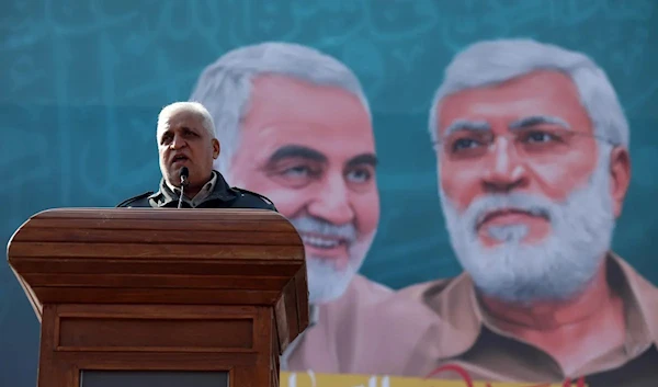 PMF chief Faleh al-Fayyad delivers a speech commemorating the assassination of the IRGC's Quds Force commander, Maj Gen Qasem Soleimani, and PMF vice president Abu Mahdi Al-Muhandis, on 3 January 2021 in Baghdad, Iraq (AA Photo)