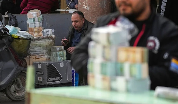 Iraq’s currency has fallen as much as 10% against the dollar as controls have been implemented on the US currency (AP)