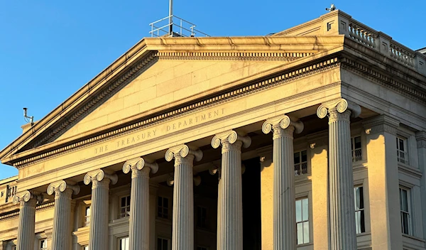 The Treasury Department is seen near sunset in Washington, Wednesday, Jan. 18, 2023 (AP Photo/Jon Elswick)