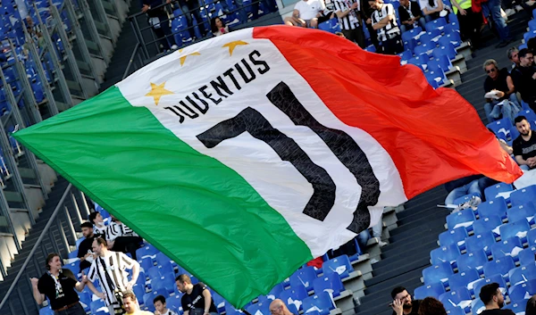 Coppa Italia - Final - Juventus v Inter Milan - Stadio Olimpico, Rome, Italy - May 11, 2022 A Juventus fan waves a flag inside the stadium before the match (REUTERS/Ciro De Luca)