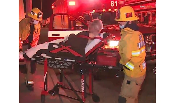 Firefighters prepare to transport a patient after a reported shooting late Saturday during a Lunar New Year event in Monterey Park. (RMG News)