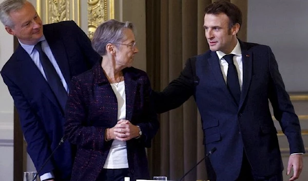 French President Emmanuel Macron and French Prime Minister Elisabeth Borne. (AP)