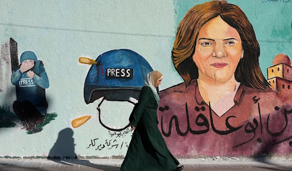 A mural of murdered Al-Jazeera journalist Shireen Abu Akleh, who was shot dead during an Israeli military raid in the West Bank town of Jenin, is seen on a wall in Gaza City on May 15, 2022. (AP)