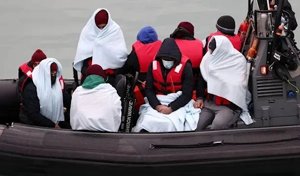 People are brought into Dover harbour onboard a Border Force vessel after crossing the Channel. (Reuters)