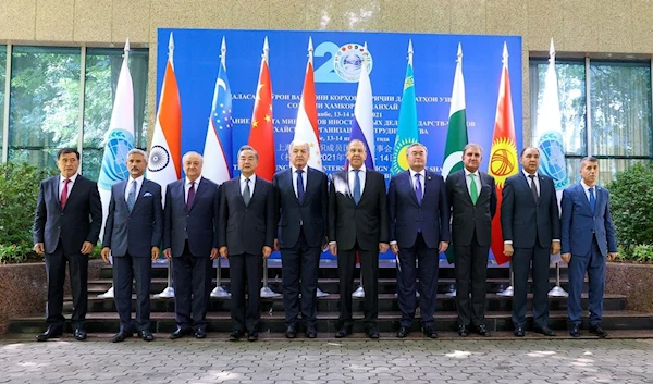 Foreign ministers and officials of the Shanghai Cooperation Organisation (SCO) pose for a group photo during a meeting in Dushanbe, Tajikistan July 14, 2021 (Reuters).