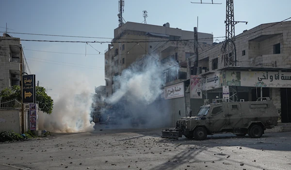 Palestinians clash with Israeli occupation forces following a raid in the West Bank city of Jenin, Palestine Thursday, Jan. 26, 2023 (AP Photo/Majdi Mohammed)