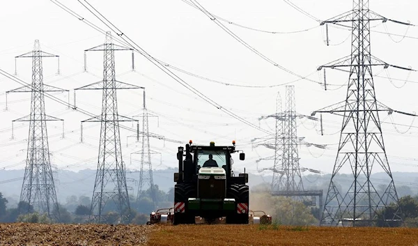 Electricity pylons in Ratcliffe-on-Soar, in a field in the UK (Reuters)