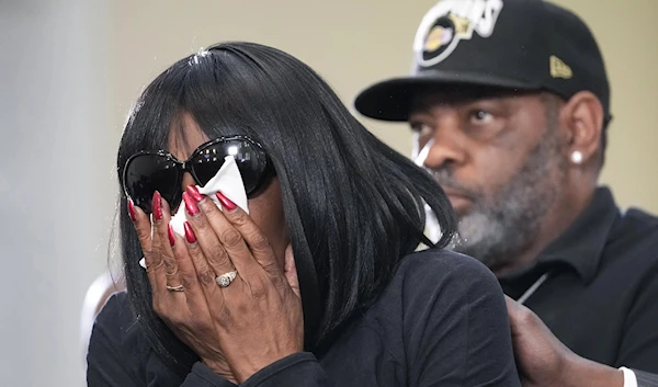 RowVaughn Wells, Tyre Nichols' mother, cries as she is comforted by Nichols' stepfather, Rodney Wells, at a news conference with civil rights attorney Benjamin Crump in Memphis, Tennessee, January 23, 2023 (AP Photo)