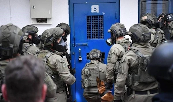 Israeli occupation forces preparing to break into a prison bloc