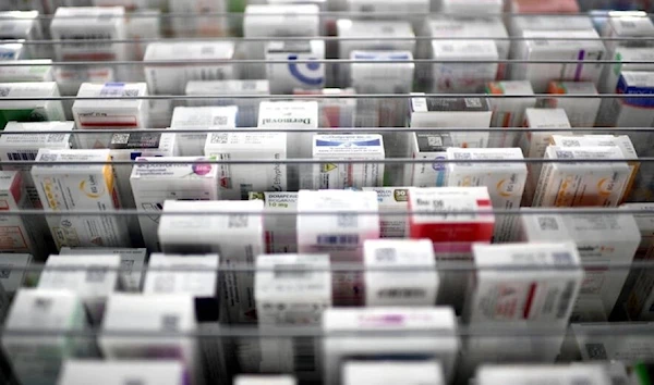 This photograph taken on October 19, 2022, shows medicine boxes on shelves at a pharmacy in Paris. (AFP)