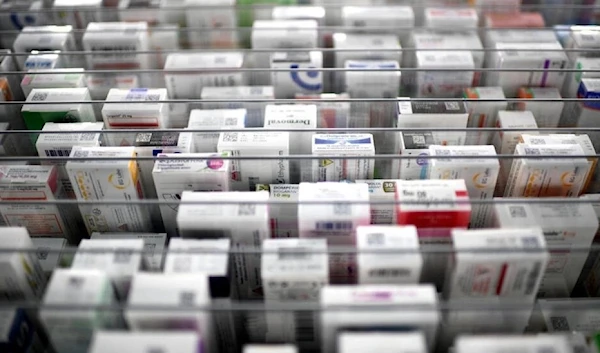 This photograph taken on October 19, 2022, shows medicine boxes on shelves at a pharmacy in Paris. (AFP)