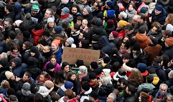 demonstrators march in Place de la Republique during a rally in Paris, as workers go on strike over the French President's plan to raise the legal retirement age from 62 to 64. (AFP)