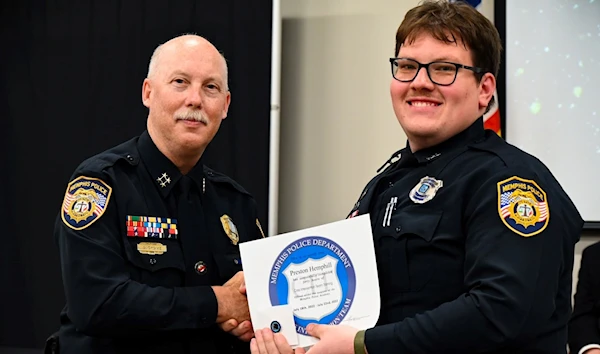 Suspended officer Preston Hemphill (right) with a senior police officer receiving recognition (Memphis Police)