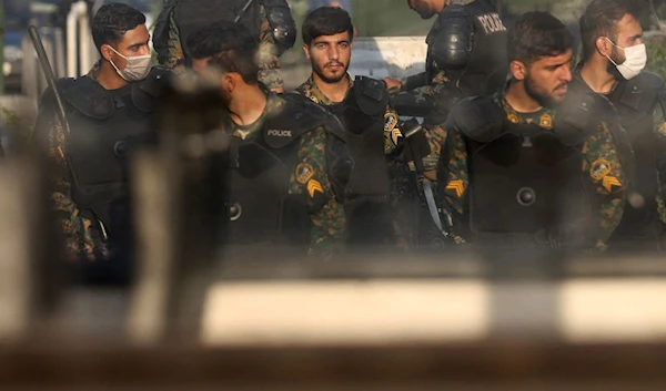 Iranian police officers stand in a street in Tehran, Iran October 3, 2022 (Reuters)