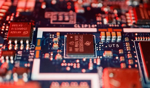 Semiconductor chips are seen on a circuit board of a computer (REUTERS/Florence Lo)