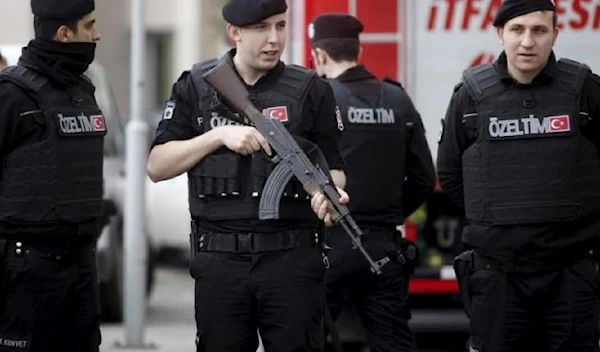 Turkish riot police stand guard in front of the Justice Palace in Istanbul. (REUTERS)