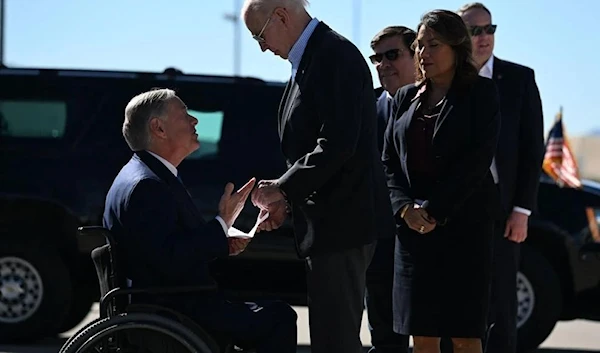 President Joe Biden is greeted by Texas Gov. Greg Abbott upon arrival at El Paso International Airport in El Paso, Texas, on Jan. 8, 2023. (Jim Watson/AFP)