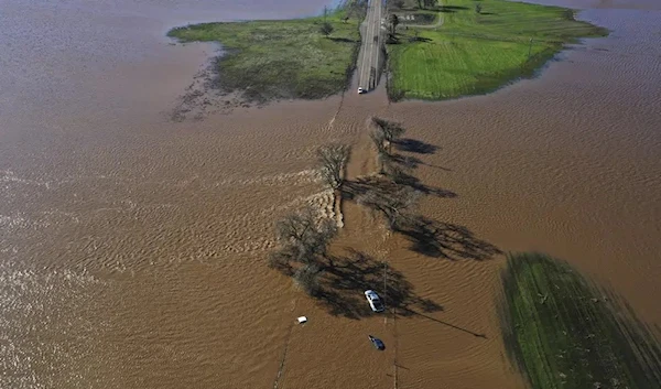 Three vehicles are submerged on Dillard Road west of Highway 99 in south Sacramento County in Wilton, Calif., Sunday, Jan. 1, 2023.  (AP)