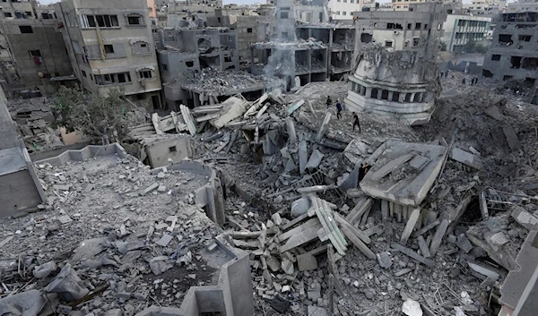 Palestinians inspect the rubble of the Yassin Mosque destroyed after it was hit by an Israeli airstrike at Shati refugee camp in Gaza City, early Monday, Oct. 9, 2023. (AP)