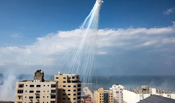 Airbursts of artillery-fired white phosphorus fall over the Gaza city port, October 11, 2023. (AFP)