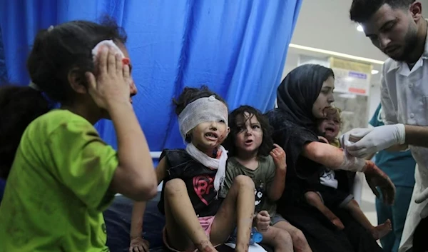 Palestinian children wounded in Israeli strikes are brought to Shifa Hospital in Gaza City on Oct. 11, 2023. (AP)