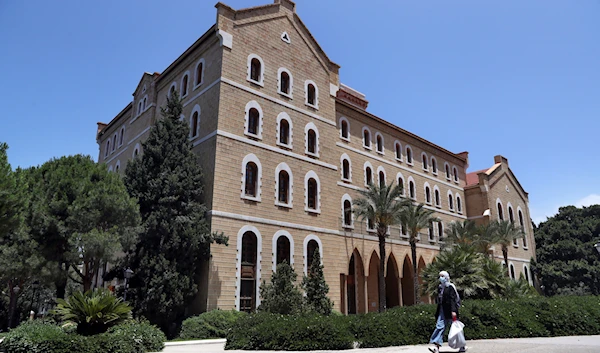 A woman walks on American University of Beirut's campus (AUB,) one of the oldest and most prestigious education institutions in the Middle East region, Monday, June. 22, 2020. (AP)