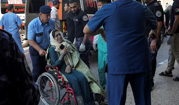 Palestinians wounded in Israeli air strikes on Gaza Strip are brought to al-Aqsa hospital in Deir el-Balah, Gaza Strip, Saturday, Oct. 14, 2023 (AP Photo/Adel Hana)