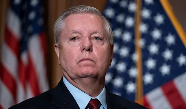 Senator Lindsey Graham waits to speak to reporters at the US Capitol in Washington, DC, on February 10, 2022 (AP)