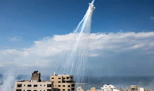 Smoke from an Israeli bombardment is shown over the Gaza City seaport on October 11, 2023 (AFP)