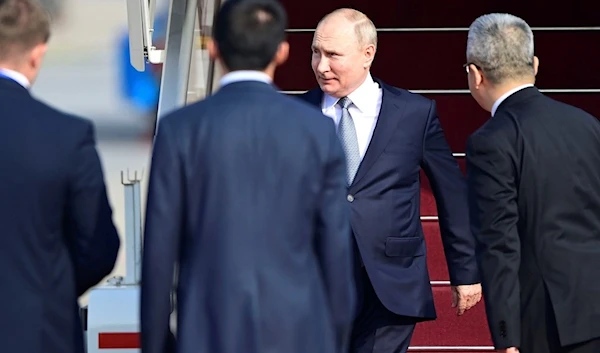 Russia's President Vladimir Putin, rear center, arrives at Beijing Capital International Airport to attend the third Belt and Road Forum in Beijing, Tuesday, Oct. 17, 2023.