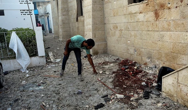 A Palestinian man inspects the damage at al-Ahli hospital, in Gaza City, Palestine Wednesday, Oct. 18, 2023. (AP)