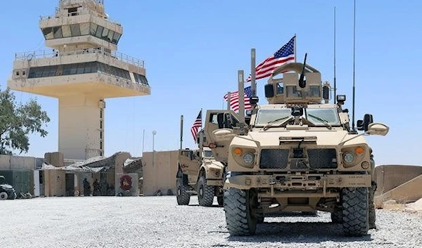 Airmen with the Security Forces Flight, 443d Expeditionary Squadron, conduct a flight line patrol with U.S. flags flying from their Mine Resistant Ambush Protected-All Terrain Vehicles at Al Asad Air Base on July 4, 2021 (U.S. Army National Guard)