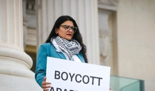 Rep. Rashida Tlaib, D-Mich., holds a sign that reads “boycott apartheid” outside the US Capitol on July 17, 2023. (AP)