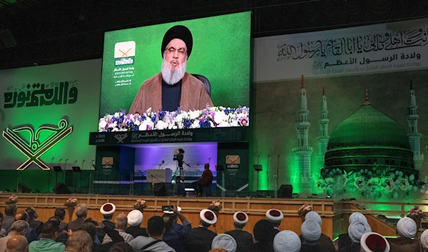 Hezbollah leader Sayyed Hassan Nasrallah speaks via a video link during a ceremony marking Prophet Muhammad's birthday, in the southern of Beirut, Lebanon, October 2, 2023 (AP)