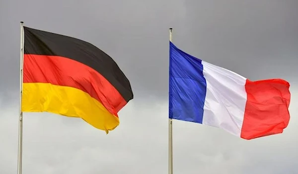 Flags of Germany and France flutter on flagpoles (AFP)