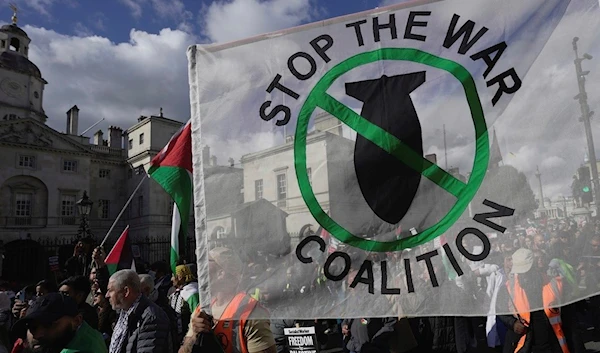 Protesters march during a pro Palestinian demonstration in London, Saturday, Oct. 14, 2023. (AP)