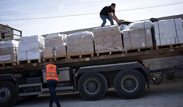 Trucks with humanitarian aid for the Gaza Strip enter from Egypt's in Rafah border crossing on Saturday, Oct. 21, 2023. (AP)