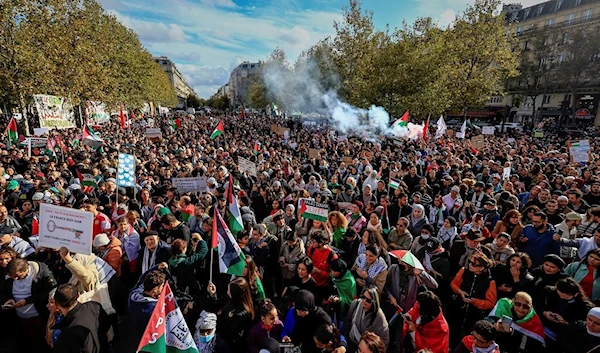 Protesters take part during a demonstration organized by the National Collective for a just and lasting peace between Palestinians and Israelis in Paris, Sunday, Oct. 22, 2023. (AP)