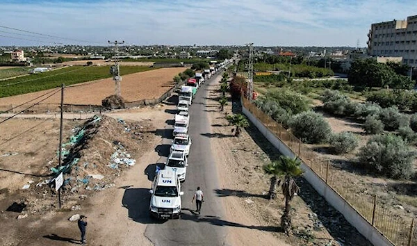 This aerial view shows humanitarian aid trucks arriving at a storage facility in Khan Younis in the southern Gaza Strip on October 21, 2023 after crossing the Rafah border (AFP)