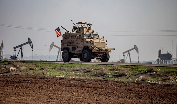 US occupation forces vehicle is seen on a patrol in the countryside near the town of Qamishli, Syria, Sunday, Dec. 4, 2022. (AP)